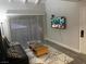 Cozy living room with a comfortable sofa, TV, accent rug, and large window at 1515 E Reno Ave # D202, Las Vegas, NV 89119