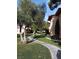 Manicured lawns and peaceful walkway of home exterior at 1515 E Reno Ave # D202, Las Vegas, NV 89119