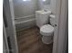 A bathroom featuring a white tiled tub and shower, white vanity, and vinyl floors at 1713 Fairfield Ave, Las Vegas, NV 89102