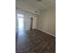 Neutral bedroom featuring dark wood look floors and closet storage at 1713 Fairfield Ave, Las Vegas, NV 89102