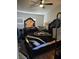 Bedroom featuring a dark wood bed frame, Raider's blanket, ceiling fan, and wood look floors at 1713 Fairfield Ave, Las Vegas, NV 89102
