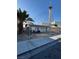 Exterior view of home with a chain-link fence and view of the Stratosphere at 1713 Fairfield Ave, Las Vegas, NV 89102