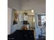 Cozy living room corner view with a glimpse of the kitchen and artwork on the wall at 1713 Fairfield Ave, Las Vegas, NV 89102
