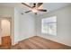 Bright bedroom with a ceiling fan, large window, and neutral carpet at 2050 W Warm Springs Rd # 4512, Henderson, NV 89014