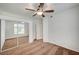 This bedroom features a ceiling fan, carpet, and mirrored closet doors at 2050 W Warm Springs Rd # 4512, Henderson, NV 89014
