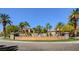 Well-maintained community entrance with fountains and lush landscaping at 2050 W Warm Springs Rd # 4512, Henderson, NV 89014