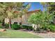 Exterior view of home surrounded by mature landscaping and lush green lawns at 2050 W Warm Springs Rd # 4512, Henderson, NV 89014