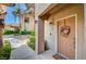Inviting entryway with a charming front door and a beautiful floral wreath, creating a warm welcome at 2050 W Warm Springs Rd # 4512, Henderson, NV 89014