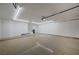 Spacious and well-lit three car garage with epoxy flooring and ample storage space at 2050 W Warm Springs Rd # 4512, Henderson, NV 89014