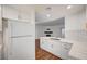 Updated kitchen features white cabinets, subway tile backsplash, and quartz countertops at 2050 W Warm Springs Rd # 4512, Henderson, NV 89014