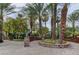 Paved driveway is adorned with trees and professionally landscaped beds at 2050 W Warm Springs Rd # 4512, Henderson, NV 89014