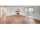 Open living room boasts a fireplace, wood floors, and balcony access at 2050 W Warm Springs Rd # 4512, Henderson, NV 89014