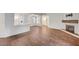 Spacious living area with wood-look floors, fireplace, and an open layout perfect for modern living at 2050 W Warm Springs Rd # 4512, Henderson, NV 89014