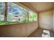 Relaxing covered patio area overlooking lush landscaping and greenery at 2050 W Warm Springs Rd # 4512, Henderson, NV 89014