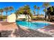 Stunning pool with a bridge, lounge chairs, and surrounding greenery for relaxation at 2050 W Warm Springs Rd # 4512, Henderson, NV 89014