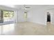 A bright primary bedroom has sliding glass doors to the backyard, and a ceiling fan at 2221 Grier Woods Ct, Las Vegas, NV 89134