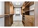 Walk-in closet with built-in shelving and drawers for ample storage at 2221 Grier Woods Ct, Las Vegas, NV 89134