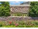 Cantabria community entrance sign with stacked stone and lush landscaping at 2221 Grier Woods Ct, Las Vegas, NV 89134