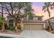 Attractive two-story home featuring a three-car garage and well-maintained landscaping at 2221 Grier Woods Ct, Las Vegas, NV 89134