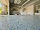 Spacious two car garage with epoxy floor, shelving and storage space at 2221 Grier Woods Ct, Las Vegas, NV 89134