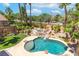 Inviting pool and spa area featuring a custom rock waterfall at 2221 Grier Woods Ct, Las Vegas, NV 89134
