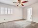Bedroom with ceiling fan, neutral carpet, and natural light from the window at 2705 Chokecherry Ave, Henderson, NV 89074