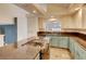 Modern kitchen showcasing granite countertops, stainless appliances, and wood floors at 2705 Chokecherry Ave, Henderson, NV 89074