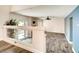 Inviting living room with light gray wood floors and modern ceiling fan at 2705 Chokecherry Ave, Henderson, NV 89074