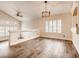 Bright living room offering wood floors and plantation shutters at 2705 Chokecherry Ave, Henderson, NV 89074