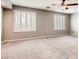 Carpeted main bedroom with plantation shutters allowing ample natural light at 2705 Chokecherry Ave, Henderson, NV 89074