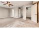 Spacious main bedroom featuring two closets and ceiling fan at 2705 Chokecherry Ave, Henderson, NV 89074