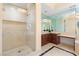 Elegant bathroom featuring a glass-enclosed shower, vanity with dark wood cabinets, and marble floors at 2747 Paradise Rd # 2704, Las Vegas, NV 89109