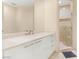 Modern bathroom with a spacious vanity, sleek white cabinetry, and a luxurious walk-in shower at 2747 Paradise Rd # 2704, Las Vegas, NV 89109