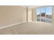 Bright bedroom with neutral carpeting and a large window overlooking the cityscape at 2747 Paradise Rd # 2704, Las Vegas, NV 89109