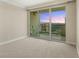 Bedroom with carpet and glass doors leading to outdoor balcony with city views at 2747 Paradise Rd # 2704, Las Vegas, NV 89109