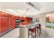 Modern kitchen with granite counters, stainless appliances, city view, and breakfast bar at 2747 Paradise Rd # 2704, Las Vegas, NV 89109