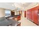 Bright kitchen with granite countertops, red cabinets, stainless steel appliances, and city views at 2747 Paradise Rd # 2704, Las Vegas, NV 89109