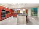 Modern kitchen features custom cabinets, granite counters, breakfast bar, and city views at 2747 Paradise Rd # 2704, Las Vegas, NV 89109