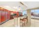 Modern kitchen featuring updated appliances and breakfast bar with city views at 2747 Paradise Rd # 2704, Las Vegas, NV 89109