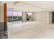 Open living room with marble floors, large windows, and modern recessed lighting at 2747 Paradise Rd # 2704, Las Vegas, NV 89109