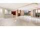 Spacious living room with a fireplace, built-in shelves, and floor-to-ceiling windows at 2747 Paradise Rd # 2704, Las Vegas, NV 89109