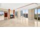 Open living area with a modern fireplace and expansive city views at 2747 Paradise Rd # 2704, Las Vegas, NV 89109