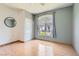 Bedroom with hardwood floors, closet, and a sunlit window at 2889 Anteres St, Las Vegas, NV 89117