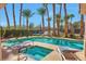 Resort-style community pool with jacuzzi and palm trees; lounge chairs are available for relaxing at 2889 Anteres St, Las Vegas, NV 89117