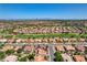 Stunning aerial shot of an expansive golf course community under a clear blue sky at 3120 Darby Falls Dr, Las Vegas, NV 89134