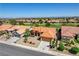 Aerial view of a home with desert landscaping and a small front yard, complete with a two-car garage at 3120 Darby Falls Dr, Las Vegas, NV 89134