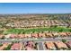 A high-altitude aerial shows a community and golf course near a desert city at 3120 Darby Falls Dr, Las Vegas, NV 89134