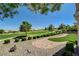 Paver patio and green space offer golf course views in this inviting backyard setting at 3120 Darby Falls Dr, Las Vegas, NV 89134