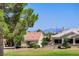 Charming single-story home with a red tile roof and mature landscaping in a suburban setting at 3120 Darby Falls Dr, Las Vegas, NV 89134