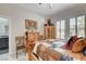 Bedroom features rustic wooden furniture and plantation shutters at 3120 Darby Falls Dr, Las Vegas, NV 89134